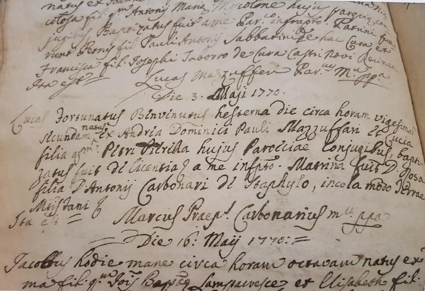 Open handwritten baptism register for the year 1770 from the parish of Passatempo, in Osimo, Italy.