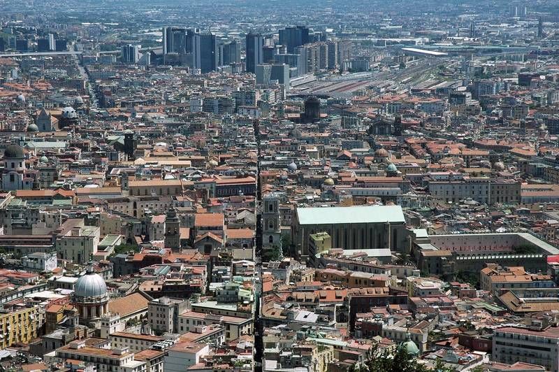 A 2010 photograph looking over Spaccanapoli in Naples, with the modern Centro Direzionale towers beyond the old streets.