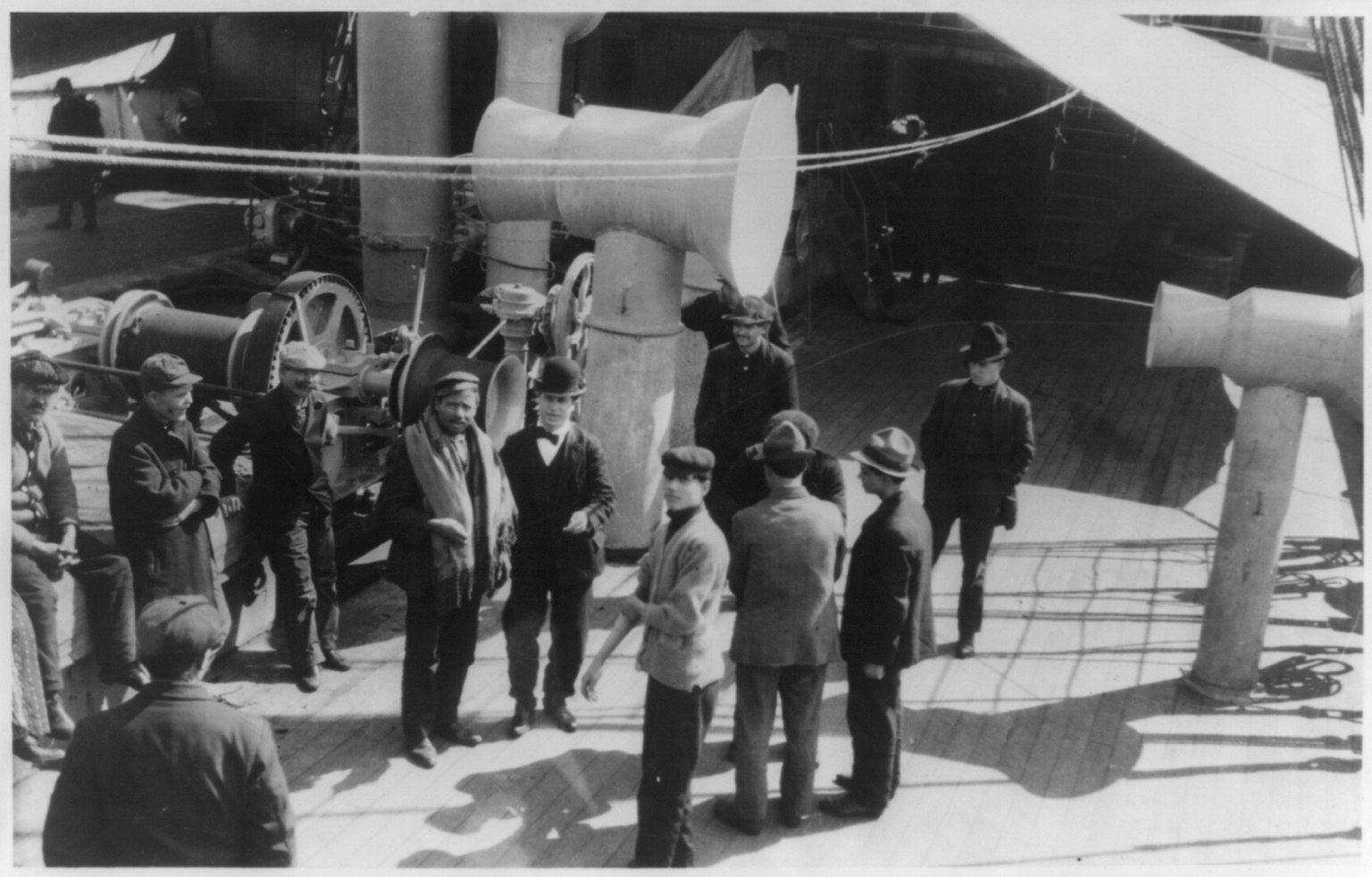 Black-and-white photograph of immigrants standing on the steerage deck of the ship Friedrich der Grosse.